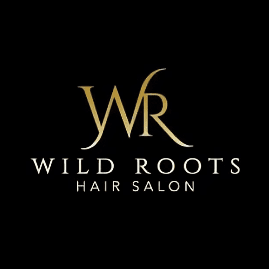 Portrait of Jaime, a professional stylist at Wild Roots Hair Salon, showcasing their expertise and style.